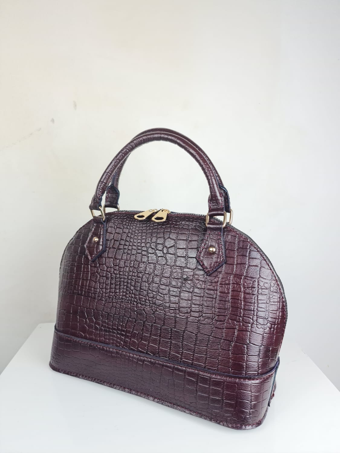 Burgundy genuine leather with snakeskin pattern