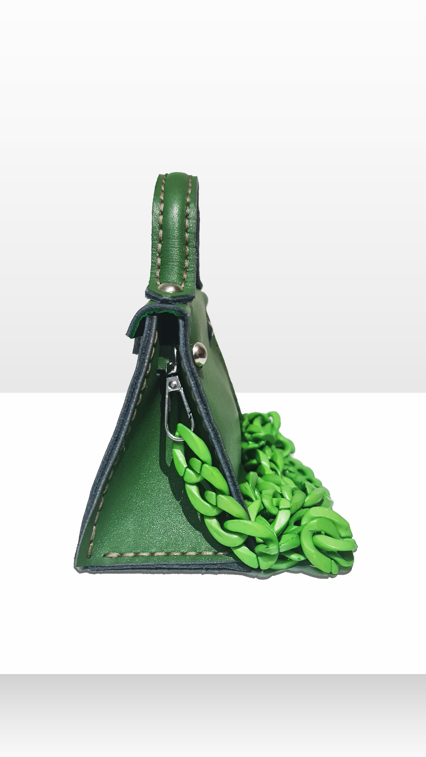 Mini green bag with a plastic chain