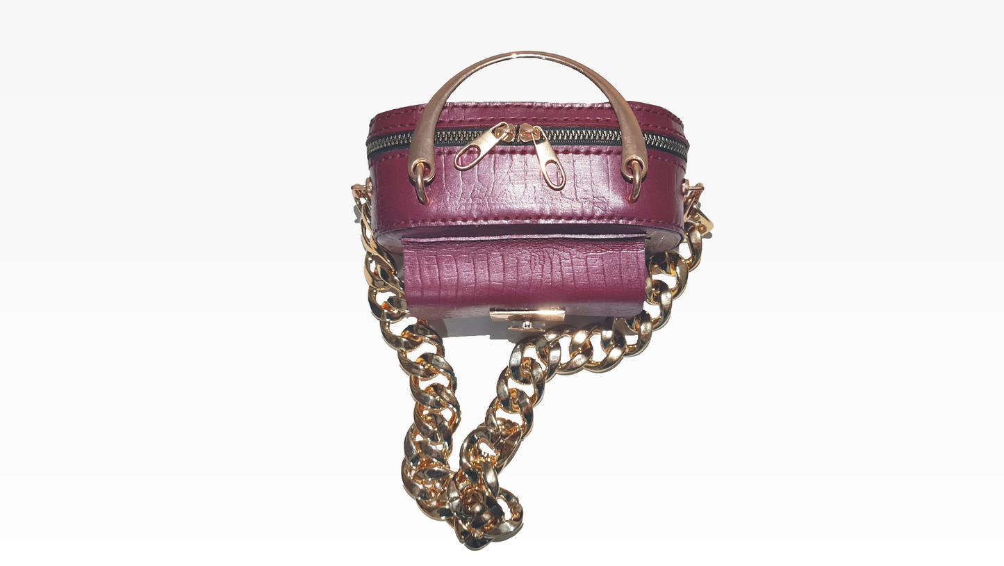 Purple Leather mini purse with a gold chain and handle